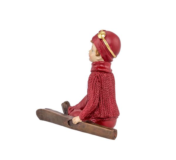 Main Image Boy with skis, sitting